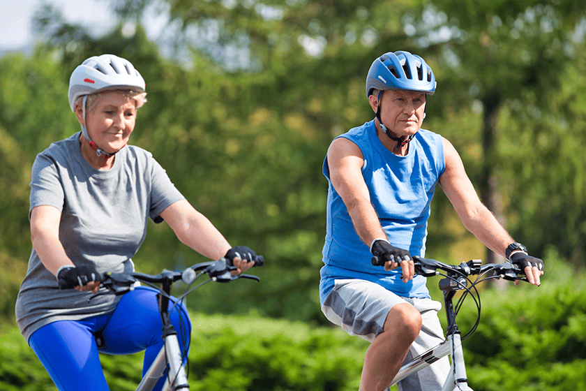 Senior couple riding bicycle