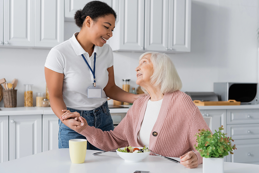 Happy multiracial social worker holding hands