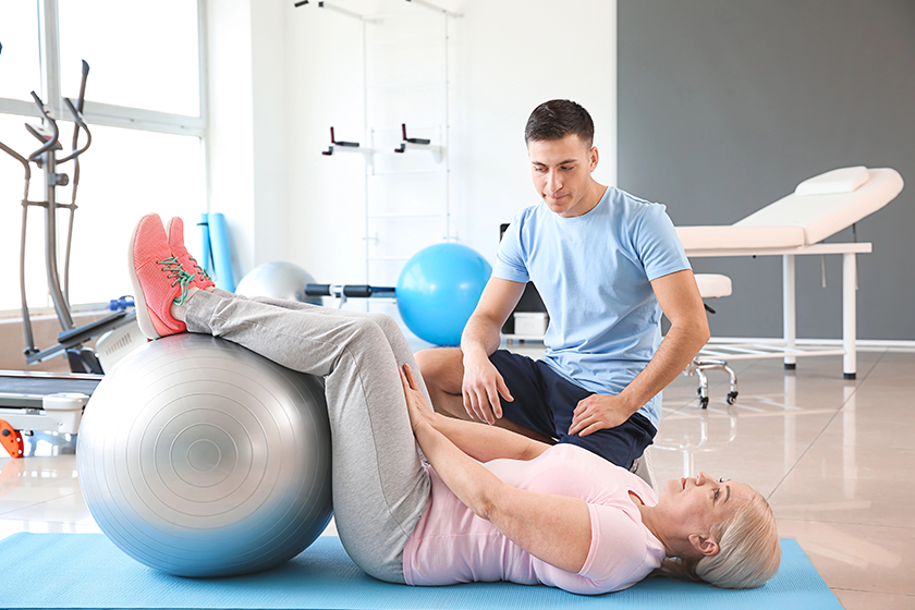 physiotherapist-working-with-mature-patient-in-rehabilitation