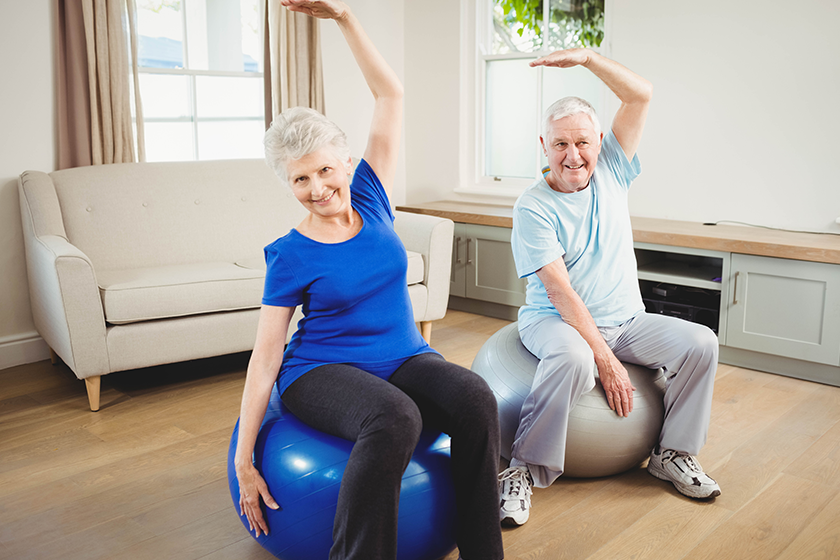 Senior couple doing stretching exercise