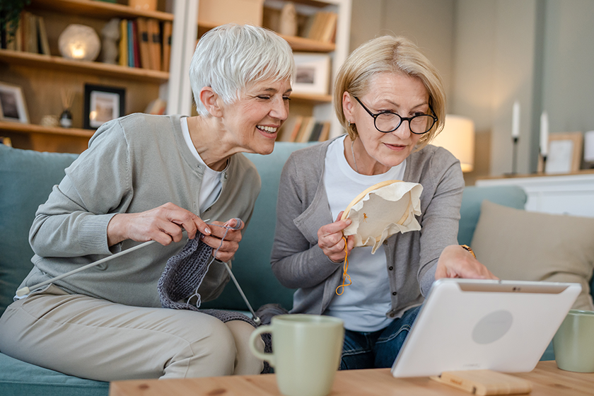 two-women-senior-mature-caucasian-friends-mother-daughter-sisters-knitting